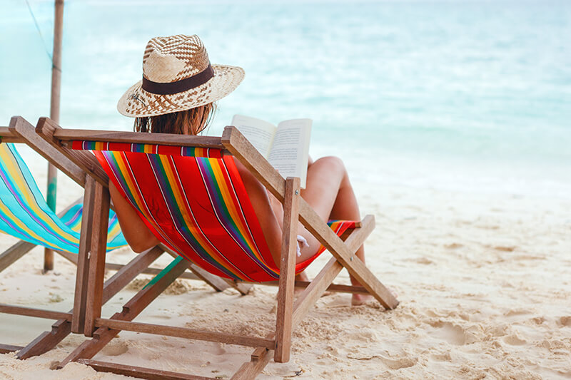 Woman reading on the beach