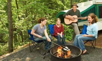 People sitting around campfire