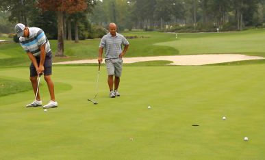 Two men golfing